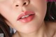 a close up of a woman's face with long brown hair